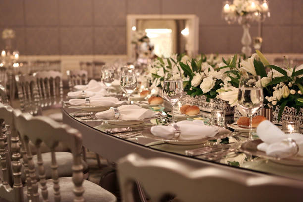 Table setting at a luxury wedding reception Table setting at a luxury wedding reception wedding feast stock pictures, royalty-free photos & images