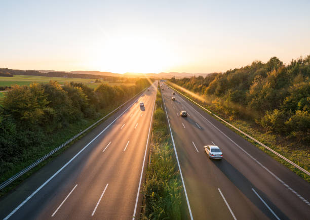 istock The road traffic on a motorway at sunset 953843588