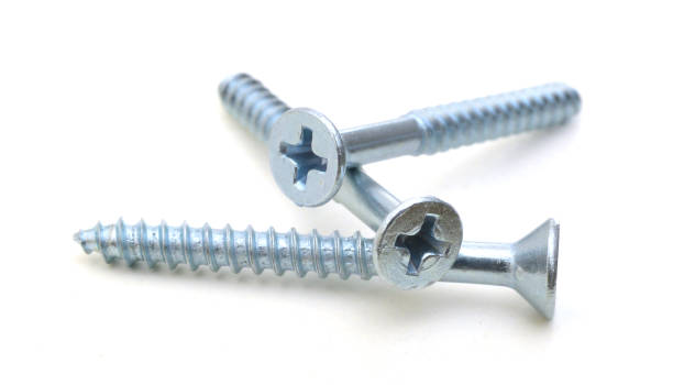 istock flat head zinc coated tapping screws, philips slot, isolated close up 953843982
