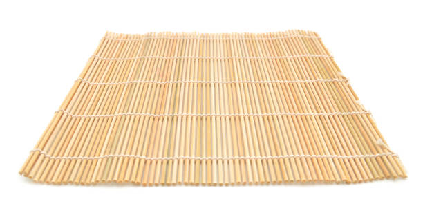 istock Close up of bamboo mat background isolated on white 953845096