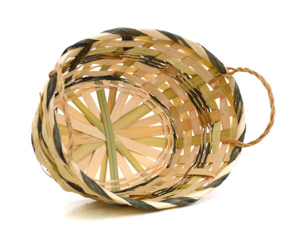 istock Wooden wicker basket isolated over white background, front view 953848482