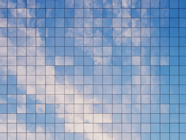 istock View of the clouds reflected in the glass office building. 3d rendering 953848892