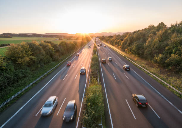 istock The road traffic on a motorway at sunset 953850072