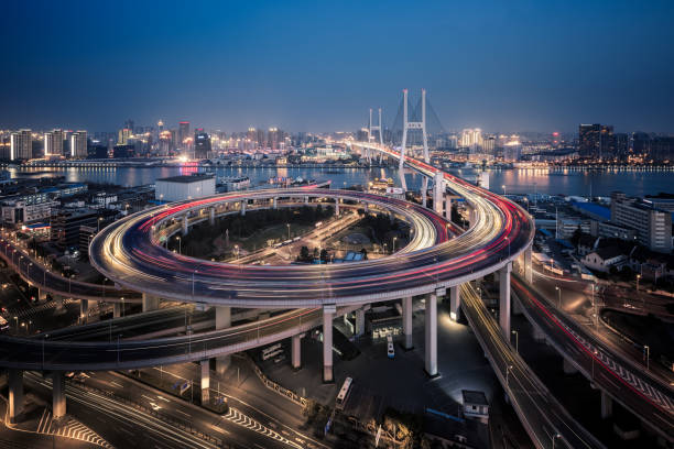 istock Bridge traffic at night in ShangHai China 953852276
