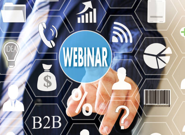 istock The businessman clicks WEBINAR button on the touch screen 953853888