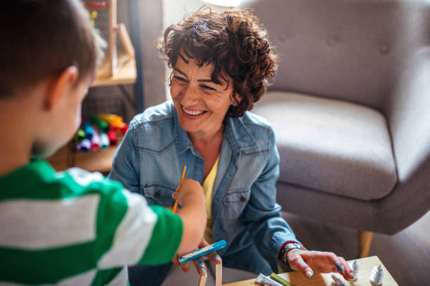 istock Mother and son coloring together 953854750