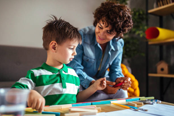 istock Mother and son coloring together 953855160