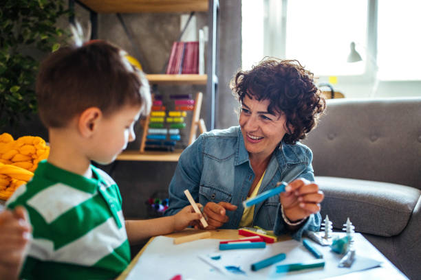 istock Mother and son coloring together 953855528