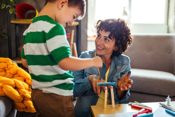 istock Mother and son coloring together 953857770