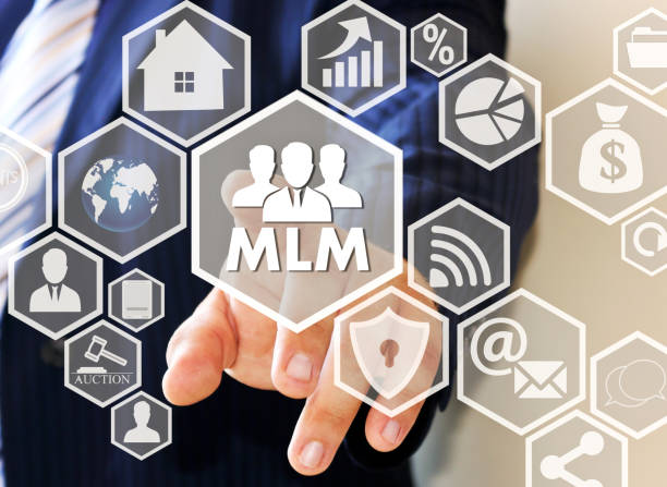 The concept of multi-level marketing. The businessman clicks the button MLM on the touch screen The businessman clicks the button MLM on the touch screen . The concept of multi-level marketing. multi level marketing stock pictures, royalty-free photos & images