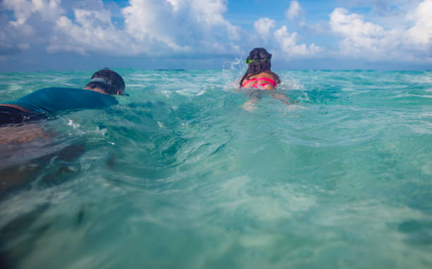 istock Father and Daughter Snorkeling Together 953859654