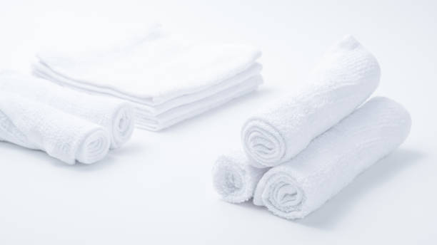 istock Rolled up white spa towels, selective focus, vintage 953865176