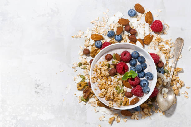istock homemade muesli with yogurt and berries on white table 953866154