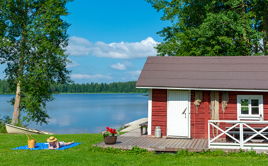 Woman sunbathing at lake