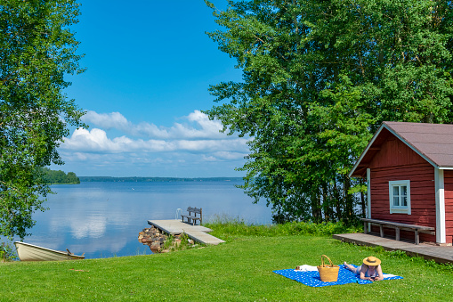 Woman sunbathing at lake