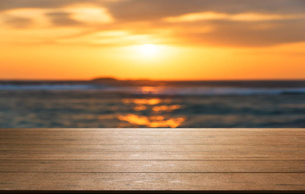 istock Empty wooden platform with sea in sunset 953875300