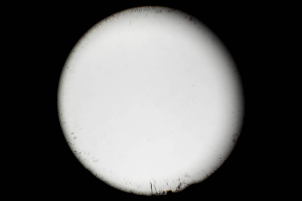 Lens magnification and artifacts peephole A old lens magnification texture, dirt and artifacts overlay black background. film camera overlay stock pictures, royalty-free photos & images