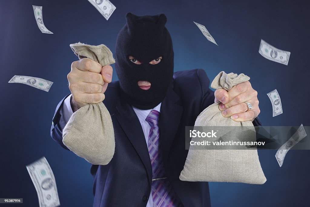 Человек с маски и сумки и деньги - Стоковые фото Банда роялти-фри