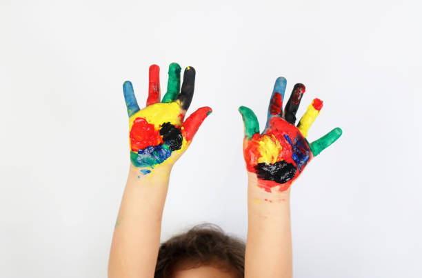 istock Cute girl with painted hands 953879196