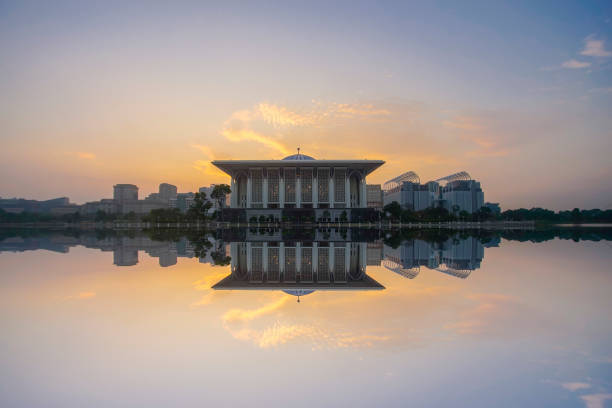 istock Mirror reflection of beautiful Iron Mosque during blue hour. 953880982