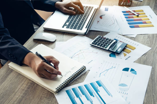 istock Business women analysis analyst statistics document her workplace in office. Teamwork workplace strategy Concept. 953888280