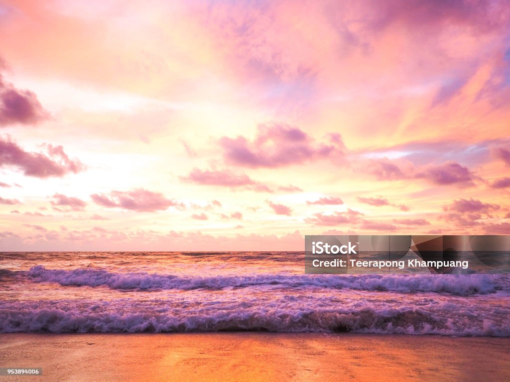 Colorful sunset on the tropical beach with beautiful sky Colorful sunset on the tropical beach with beautiful sky, clouds, soft waves Romantic Sky Stock Photo