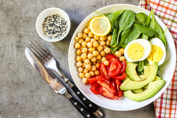 istock Healthy salad bowl with chickpeas, goose meat , tomatoes, avocado, lemon and spinach 953896258