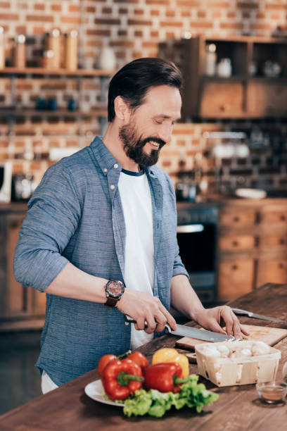 istock man cooking vegetable salad 953896460
