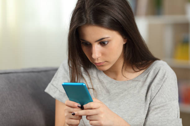 istock Girl texting obsessed with a smart phone 953900494