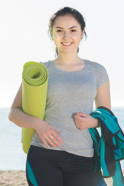 istock woman ready to start morning training on beach 953902850