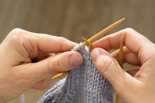 istock knitting in woman hands 953902996