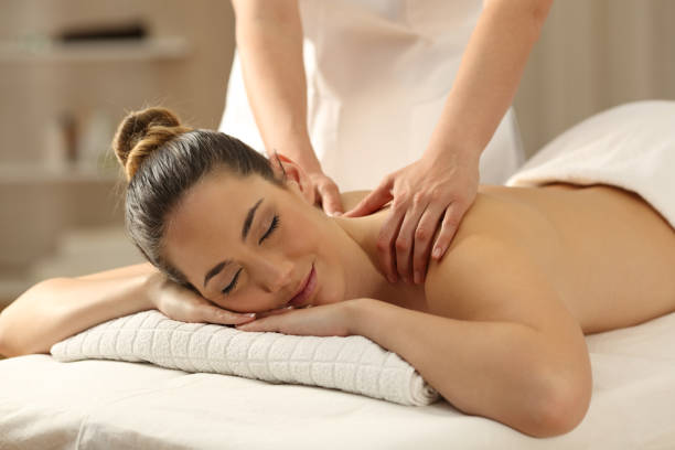 istock Relaxed lady receiving a massage in a spa 953903844