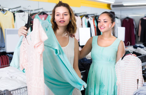 istock Girls are choosing new clothes 953905102