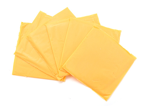 processed sliced cheese isolated on white