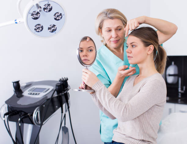 istock Cosmetologist consulting young woman 953906744