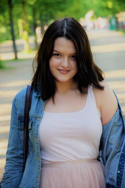 istock young smiling girl in the park 953909278