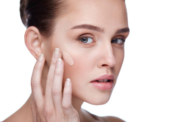 istock Beautiful Female Model With Makeup And Cream Foundation. Beauty 953910458