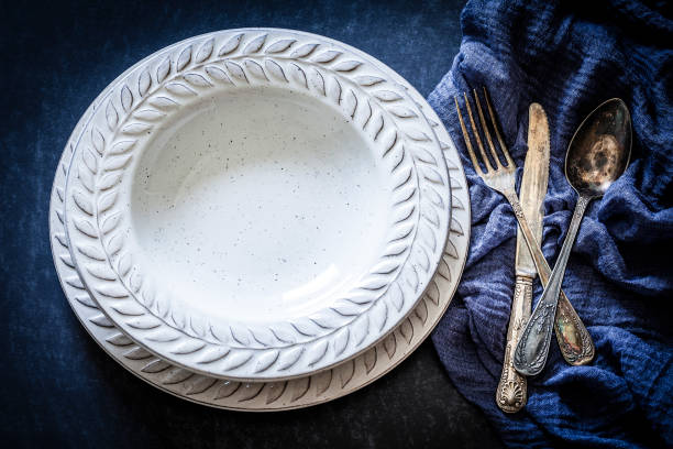 istock Vintage place setting shot from above on dark background 953910602
