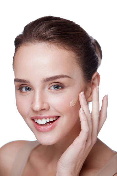 istock Beauty Makeup. Woman With Beautiful Makeup Applying Foundation 953910856