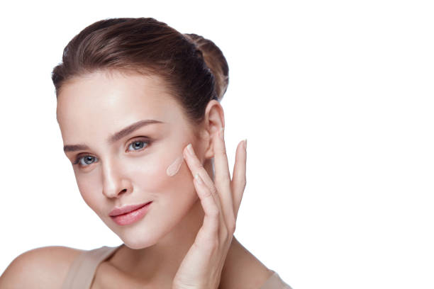 istock Beautiful Female Model With Makeup And Cream Foundation. Beauty 953910946
