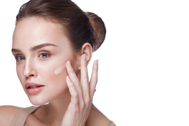 istock Beautiful Female Model With Makeup And Cream Foundation. Beauty 953911034
