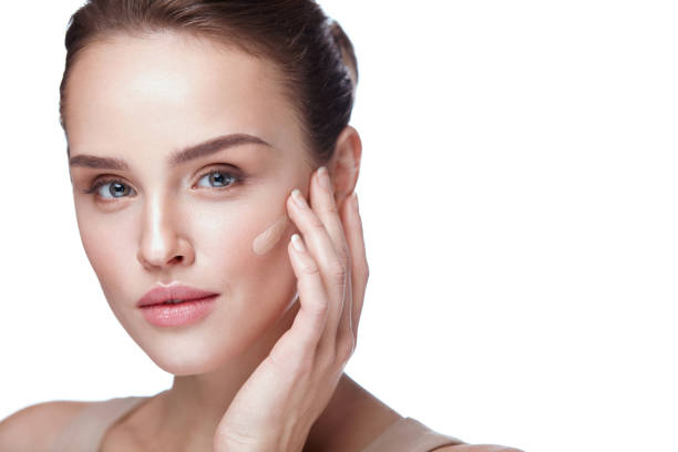 istock Beautiful Female Model With Makeup And Cream Foundation. Beauty 953911122