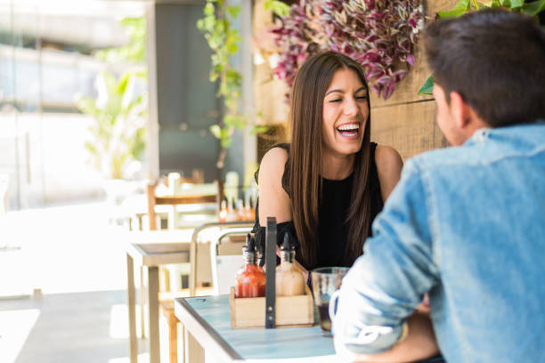 istock Happy young couple seating in a restaurant 953912058