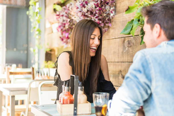 istock Happy young couple seating in a restaurant 953912086