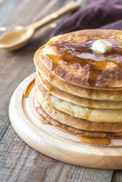istock Stack of pancakes with butter and maple syrup 953915778