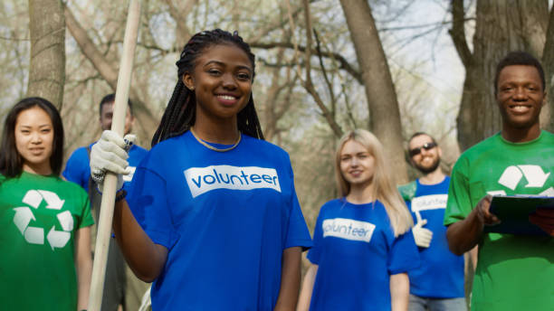 istock Cheerful multiethnic volunteers in forest 953918296