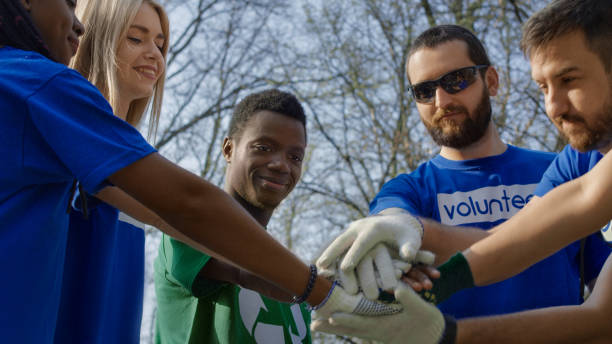 istock Excited volunteers setting mood for cleanup 953918678