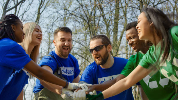 istock Excited volunteers setting mood for cleanup 953918740