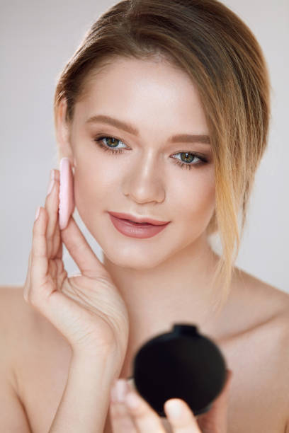 istock Woman Beauty Face. Female Applying Makeup 953929108