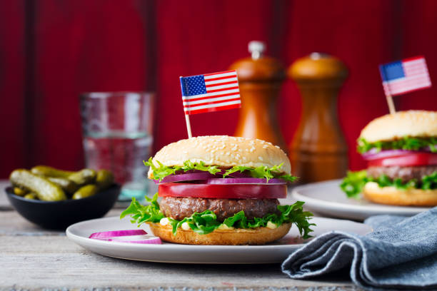 istock Burger on a plate with pickles. Wooden background. 953929166